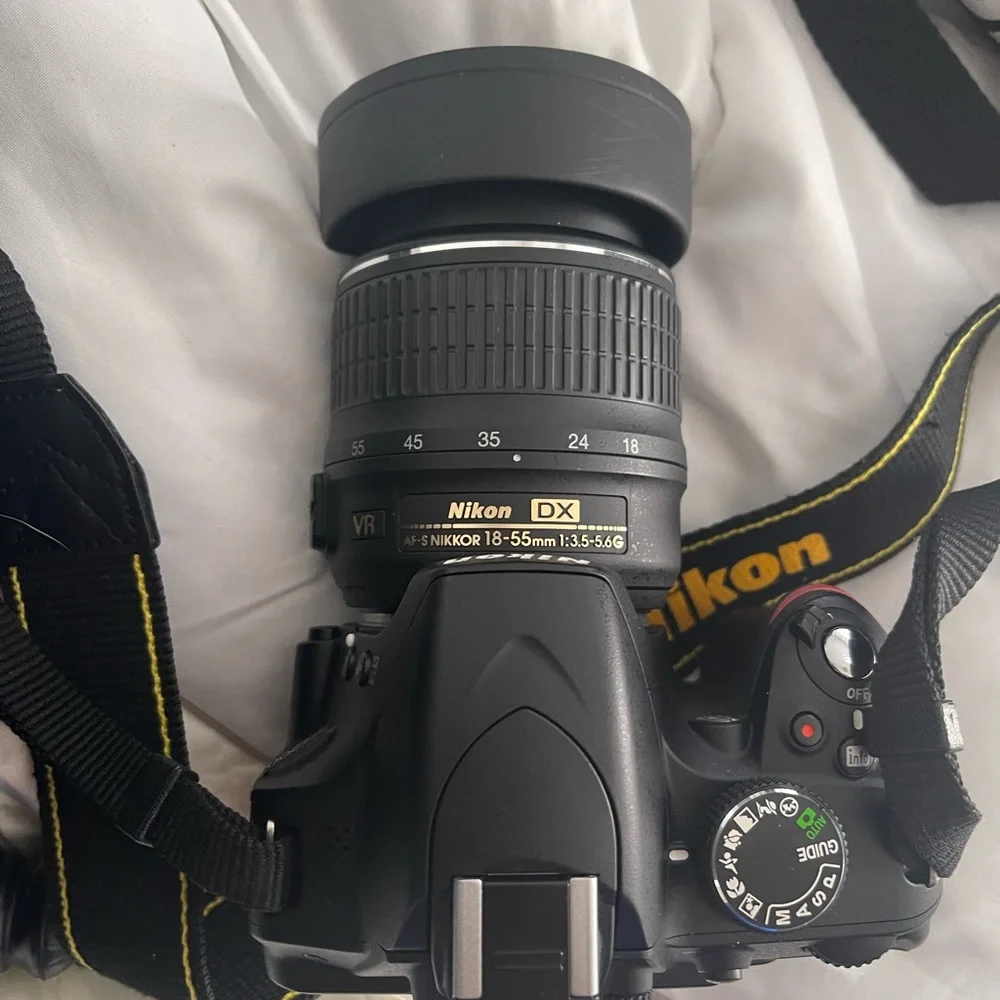 Nikon D3200 with multiple lenses, tons of attachments and comes with accessories